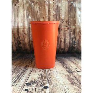Vintage 70’s tangerine orange Tupperware canister with lid.